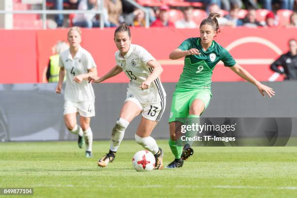 Sara Daebritz of Germany and Adrijana Mori of Slovenia battle for the ball during the 2019 FIFA women's World Championship qualifier match between...