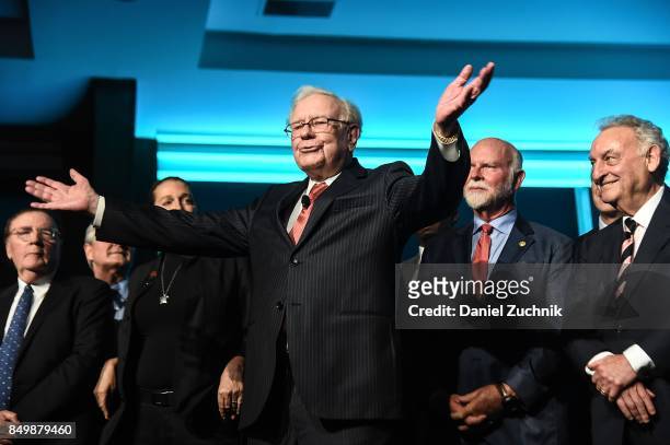 Philanthropist Warren Buffett is joined onstage by 24 other philanthropist and influential business people featured on the Forbes list of 100...