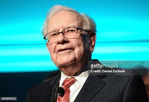 Philanthropist Warren Buffett is joined onstage by 24 other philanthropist and influential business people featured on the Forbes list of 100...