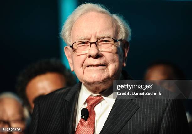 Philanthropist Warren Buffett is joined onstage by 24 other philanthropist and influential business people featured on the Forbes list of 100...