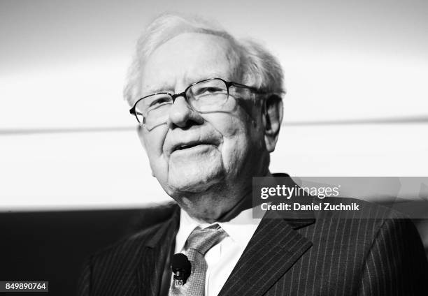 Philanthropist Warren Buffett is joined onstage by 24 other philanthropist and influential business people featured on the Forbes list of 100...