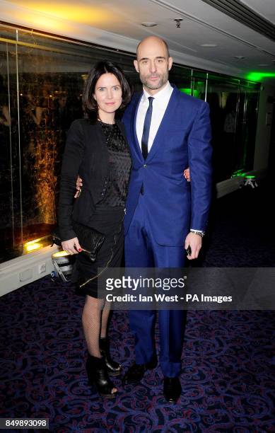 Liza Marshall and Mark Strong arriving at the Empire Film Awards at the Grosvenor House Hotel in London.