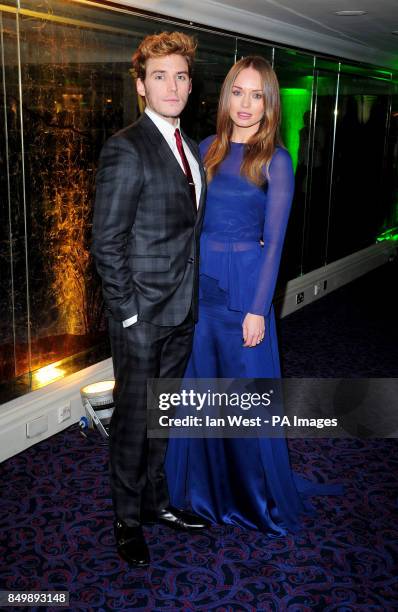 Sam Claflin and Laura Haddock arriving at the Empire Film Awards at the Grosvenor House Hotel in London.