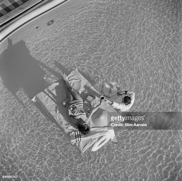 Austrian actress Mara Lane enjoys waiter service in the pool at the Sands Hotel, Las Vegas, 1954.