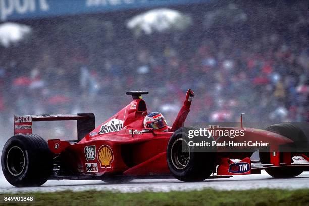 Rubens Barrichello, Ferrari F1-2000, Grand Prix of Germany, Hockenheimring, Hockenheim, Germany, July 30, 2000. Rubens Barrichello raises his hand...