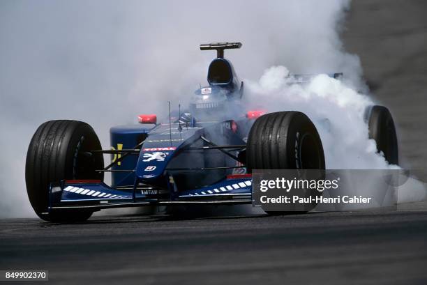 Jean Alesi, Prost-Peugeot AP03, Grand Prix of France, Circuit de Nevers Magny-Cours, France, July 2, 2000. Spin and burnout for Jean Alesi .