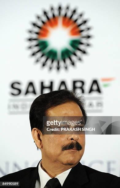 Managing Worker and Chairman of Sahara India Pariwar Subrata Roy Sahara listens to a speaker during a press conference in New Delhi on February 23,...