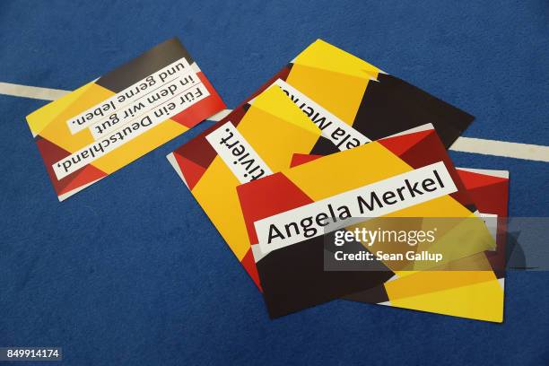 Election campaign posters lie on the ground following an election campaign stop where German Chancellor and Christian Democrat Angela Merkel spike to...
