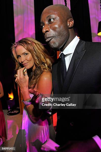 Designer Ozwald Boateng and model Elle Mcpherson attend the 17th Annual Elton John AIDS Foundation Oscar party held at the Pacific Design Center on...