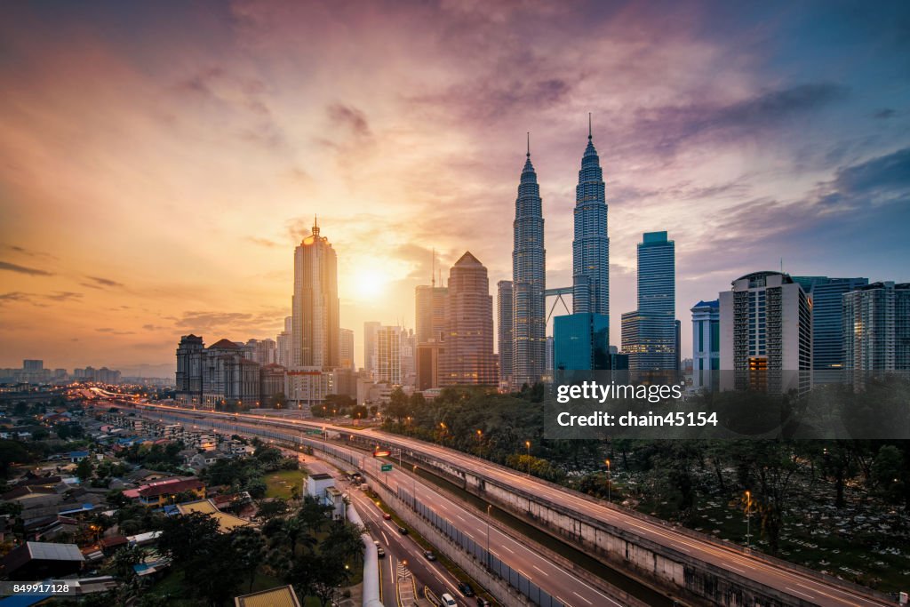 Kuala Lumpur City Centre during sunrise from rooftop of building