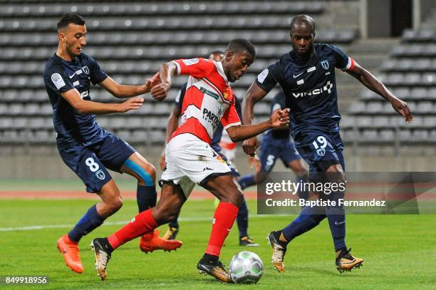 Redouane Kerrouche of Paris FC, Ferris N'Goma of Orleans and Herve Lybohy of Paris FC during the French Ligue 2 mach between Paris FC and Orleans at...