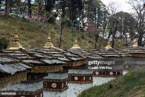 The 108 Druk Wangyal Khang Zhang Chortens, or stupas, are a sacred Bhuddist memorial. They are red-band or khangzang chortens and are located on a...