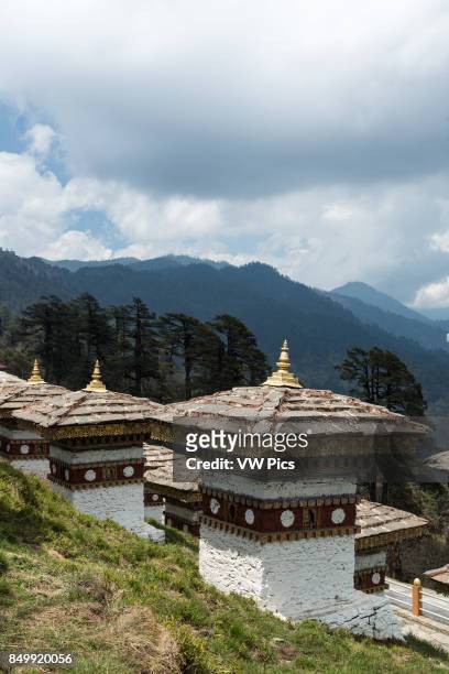 The 108 Druk Wangyal Khang Zhang Chortens, or stupas, are a sacred Bhuddist memorial. They are red-band or khangzang chortens and are located on a...