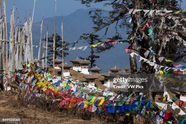 The 108 Druk Wangyal Khang Zhang Chortens, or stupas, are a sacred Bhuddist memorial. They are red-band or khangzang chortens and are located on a...