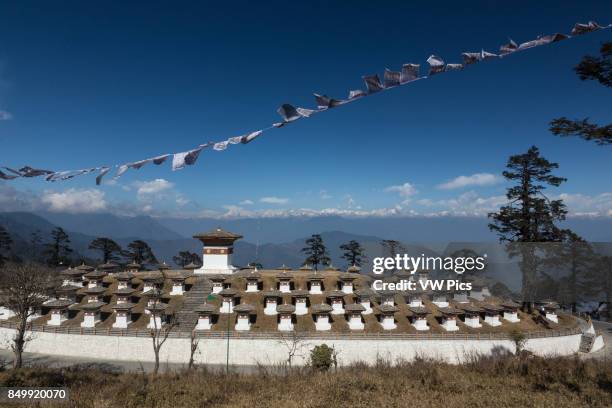 The 108 Druk Wangyal Khang Zhang Chortens, or stupas, are a sacred Bhuddist memorial. They are red-band or khangzang chortens and are located on a...