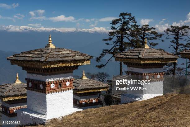 The 108 Druk Wangyal Khang Zhang Chortens, or stupas, are a sacred Bhuddist memorial. They are red-band or khangzang chortens and are located on a...