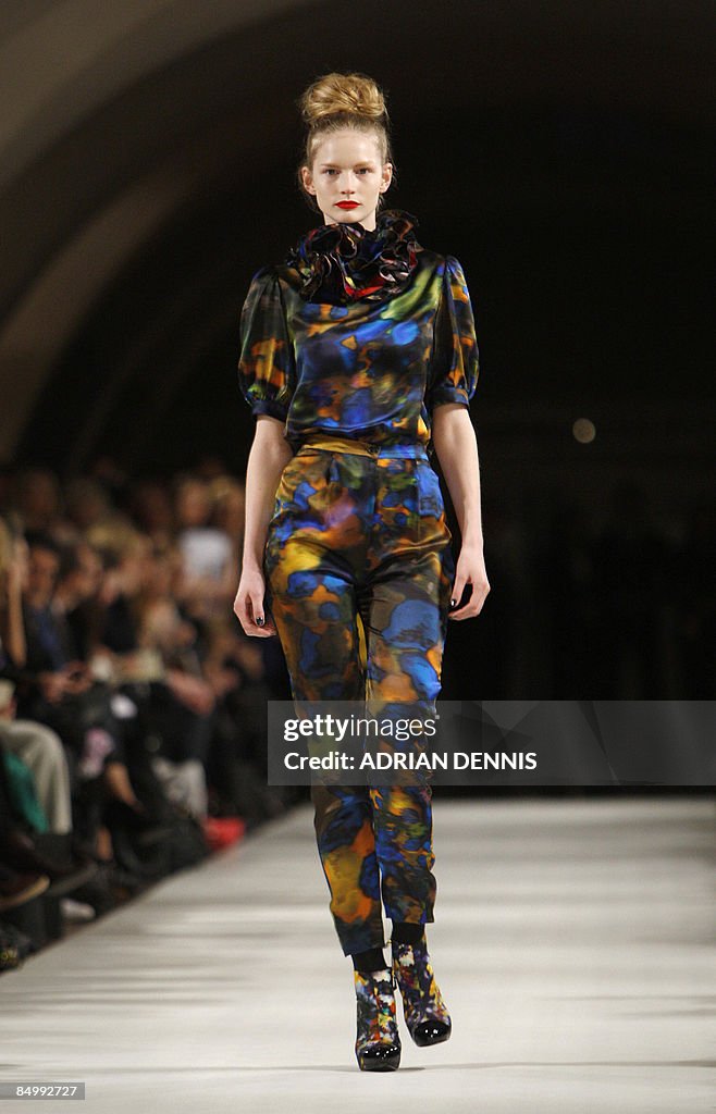 A model wears an outfit by designer Erde