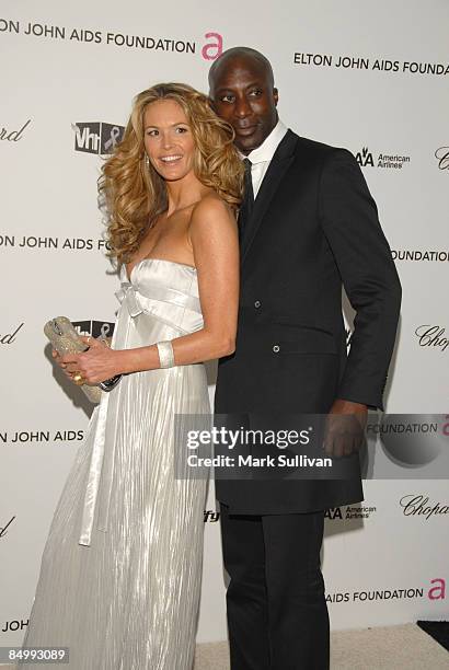 Model Elle Macpherson and guest arrive at the 17th Annual Elton John AIDS Foundation's Academy Award Viewing Party held at the Pacific Design Center...