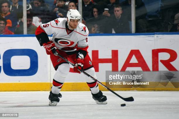 Tim Gleason of the Carolina Hurricanes skates with the puck during the game against the New York Islanders on February 19, 2009 at the Nassau...