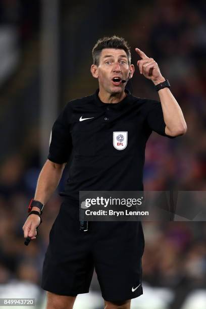 Referee Lee Probert talks to a player during the Carabao Cup Third Round match between Crystal Palace and Huddersfield Town at Selhurst Park on...