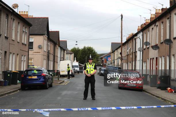 Policeman stands about a cordon on September 20, 2017 in Newport, Wales. A 48-year-old man and a 30-year-old man have been detained under the...