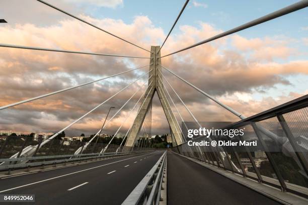 sunset over a bridge in fribourg, switzerland - fribourg canton stock pictures, royalty-free photos & images