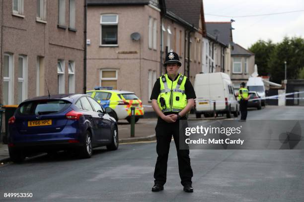 Policeman stands about a cordon on September 20, 2017 in Newport, Wales. A 48-year-old man and a 30-year-old man have been detained under the...