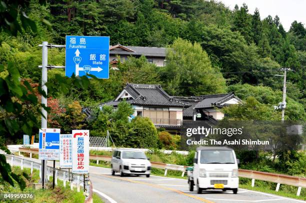 Signs along Route 114 warn of a difficult-to-return zone ahead on September 20, 2017 in Namie, Fukushima, Japan. A 27-kilometer section of National...