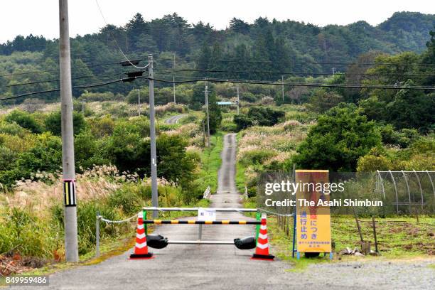 The government has set up barriers at intersections of National Route 114 to prevent cars from entering restricted areas on September 20, 2017 in...