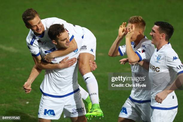 Milos Lujic of South Melbourne celebrates with team mates after scoring during the FFA Cup Quarter Final match between Gold Coast City FC and South...