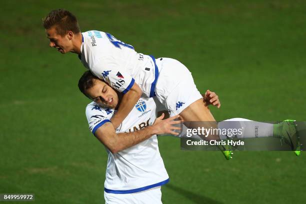 Marcus Schroen of South Melbourne jumps on Milos Lujic after he scores during the FFA Cup Quarter Final match between Gold Coast City FC and South...