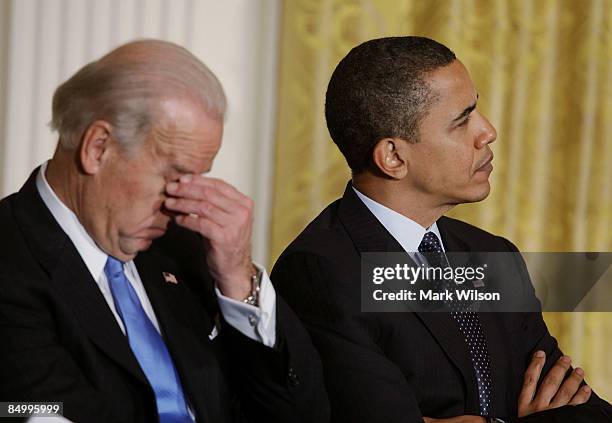 President Barack Obama and Vice President Joseph Biden participate in an event on the upcoming budget in the East Room at the White House February...