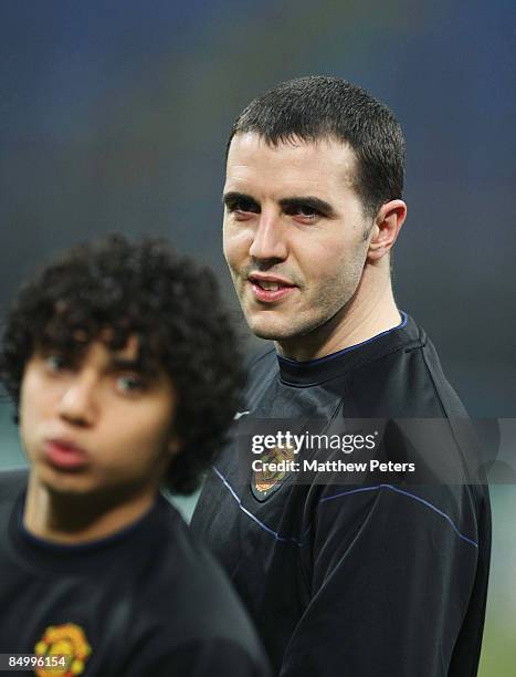 John O'Shea and Fabio Da Silva of Manchester United in action during a training session ahead of their UEFA Champions League Quarter-Final First Leg...