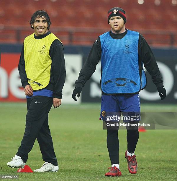 Carlos Tevez and Wayne Rooney of Manchester United in action during a training session ahead of their UEFA Champions League Quarter-Final First Leg...