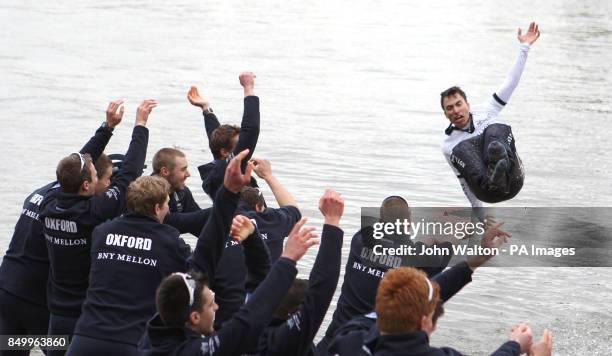 Oxford's cox Oskar Zorrilla is thrown into the river by his teammates as they celebrate winning the 159th Boat Race on the River Thames at Mortlake...