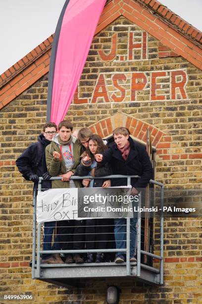 Oxford supporters watch from a balcony during the 159th Boat Race on the River Thames, London.