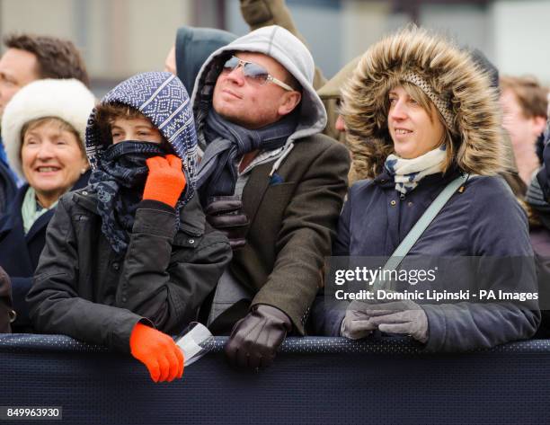 Spectators watch the 159th Boat Race on the River Thames, London.