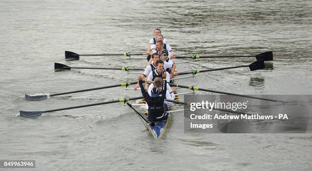 The Oxford University Eight celebrate winning the 159th Boat Race on the River Thames, London.