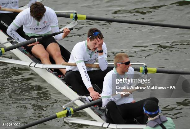 Cambridge University's Alexander Scharp looks dejected after the 159th Boat Race on the River Thames, London.