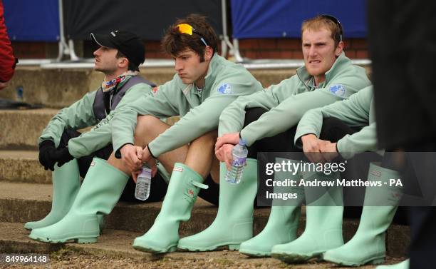 Members of the Cambridge University eight look dejected after their boat lost the 159th Boat Race on the River Thames, London.