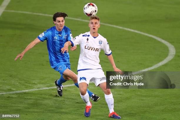 Eoghan Murphy of Gold Coast City and Jesse Daley of South Melbourne compete for the ball during the FFA Cup Quarter Final match between Gold Coast...