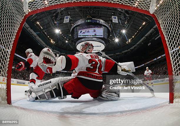 Cam Ward of the Carolina Hurricanes makes a save off a Vancouver Canuck shot during their game at General Motors Place on February 3, 2009 in...