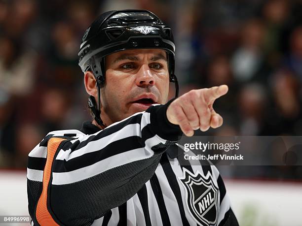 Referee Justin St. Pierre makes a call during the game between the Vancouver Canucks and the Carolina Hurricanes at General Motors Place on February...