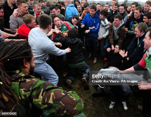Villagers participate in the traditional game of bottle kicking at Hallaton, Leicestershire.