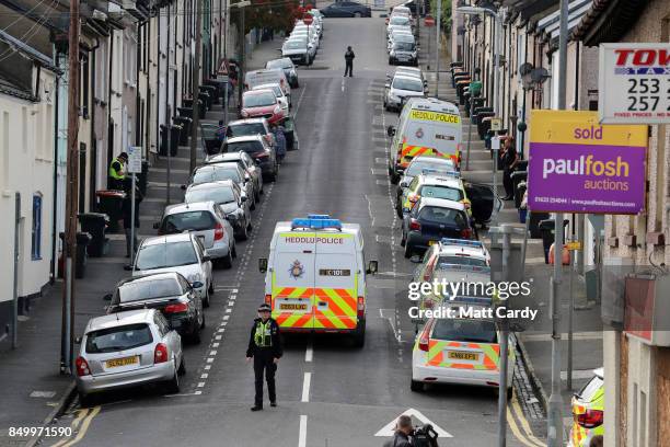 Police officers search a property on West Street on September 20, 2017 in Newport, Wales. A 48-year-old man and a 30-year-old man have been detained...