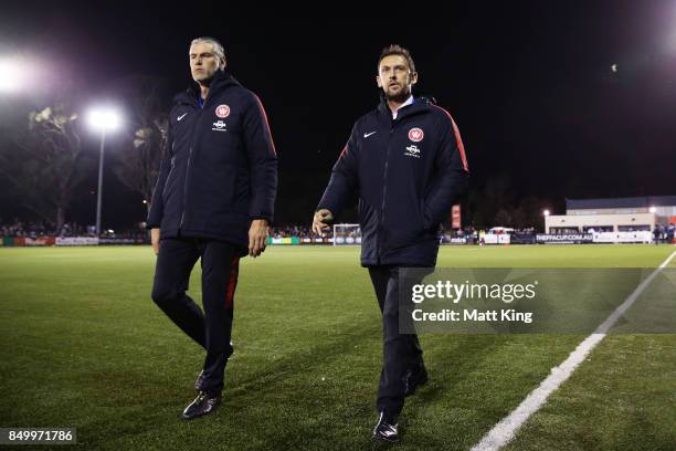 Wanderers head coach coach Tony Popovic walks with goalkeeping coach Zeljko Kalac during the FFA Cup Quarterfinal match between Blacktown City and...