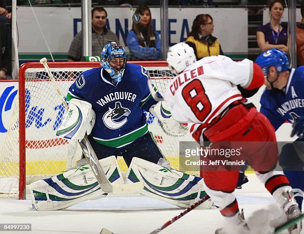 Roberto Luongo of the Vancouver Canucks makes a save off the shot of Matt Cullen of the Carolina Hurricanes during their game at General Motors Place...