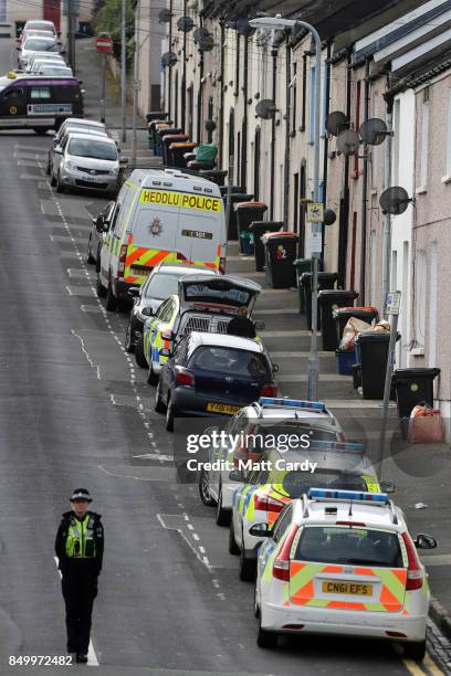 Police officers search a property on West Street on September 20, 2017 in Newport, Wales. A 48-year-old man and a 30-year-old man have been detained...