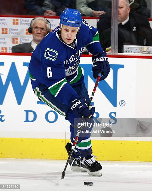 Sami Salo of the Vancouver Canucks skates up ice with the puck during their game against the Carolina Hurricanes at General Motors Place on February...