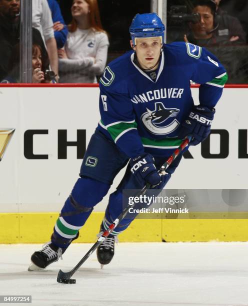 Sami Salo of the Vancouver Canucks skates up ice with the puck during their game against the Carolina Hurricanes at General Motors Place on February...